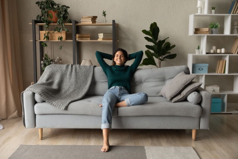 Woman relaxing in her living room.
